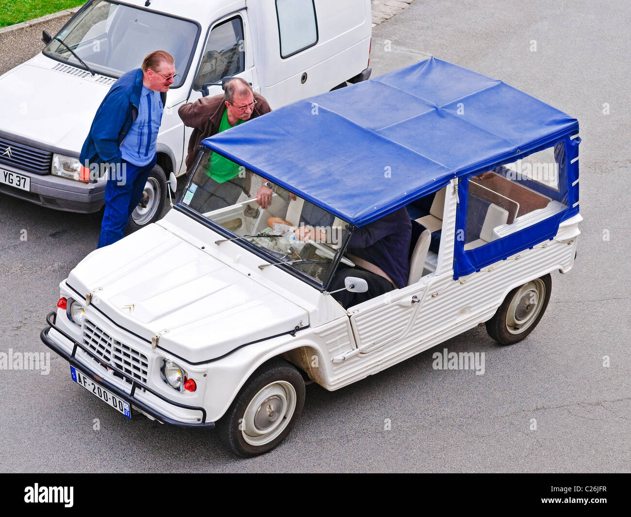 Citroen Mehari stopped in street / driver asking directions - France. Stock Photo