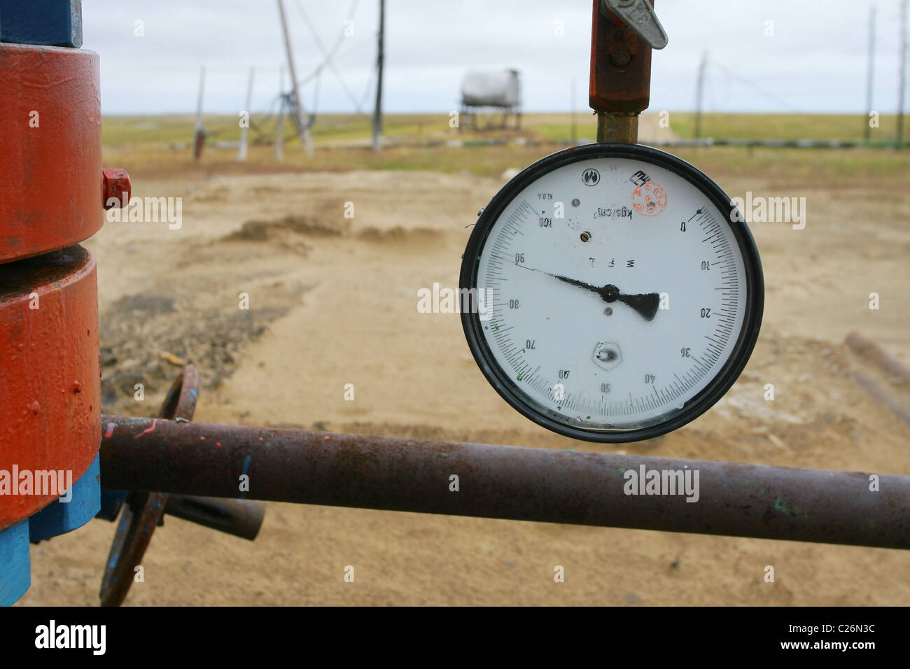 Manometer with arm in the almost marginal position; near casing head; foggy glass. Yamal peninsula, RUSSIA Stock Photo