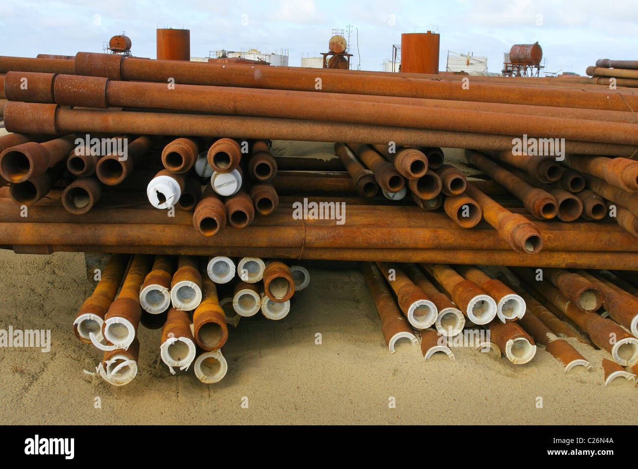 Warehouse of drill pipes with plastic lids on the end of some of them. Yamal peninsula, RUSSIA Stock Photo