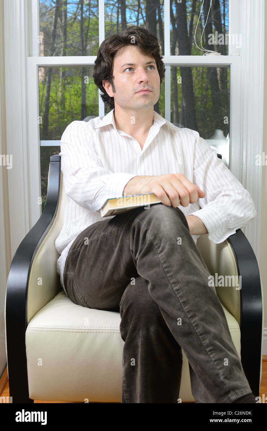 Man sitting cross legged on chair hires stock photography and images Alamy