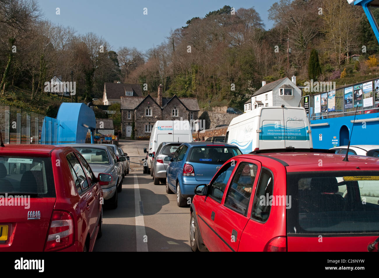 Cars waiting to disembark from the King Harry ferry on the river Fal near Truro in Cornwall, UK Stock Photo