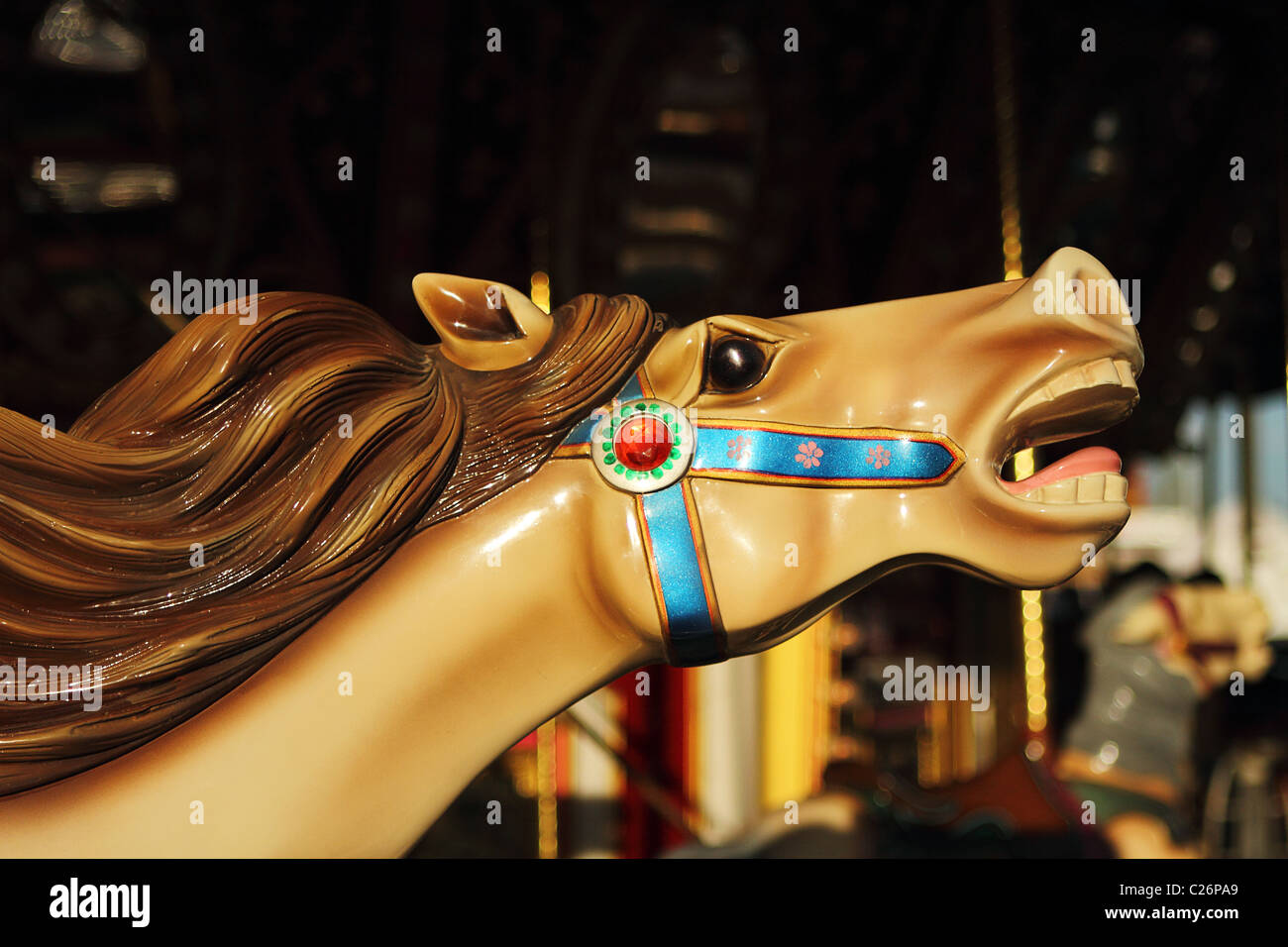 Beautifully decorated carousel horses on a merry-go-round Stock Photo