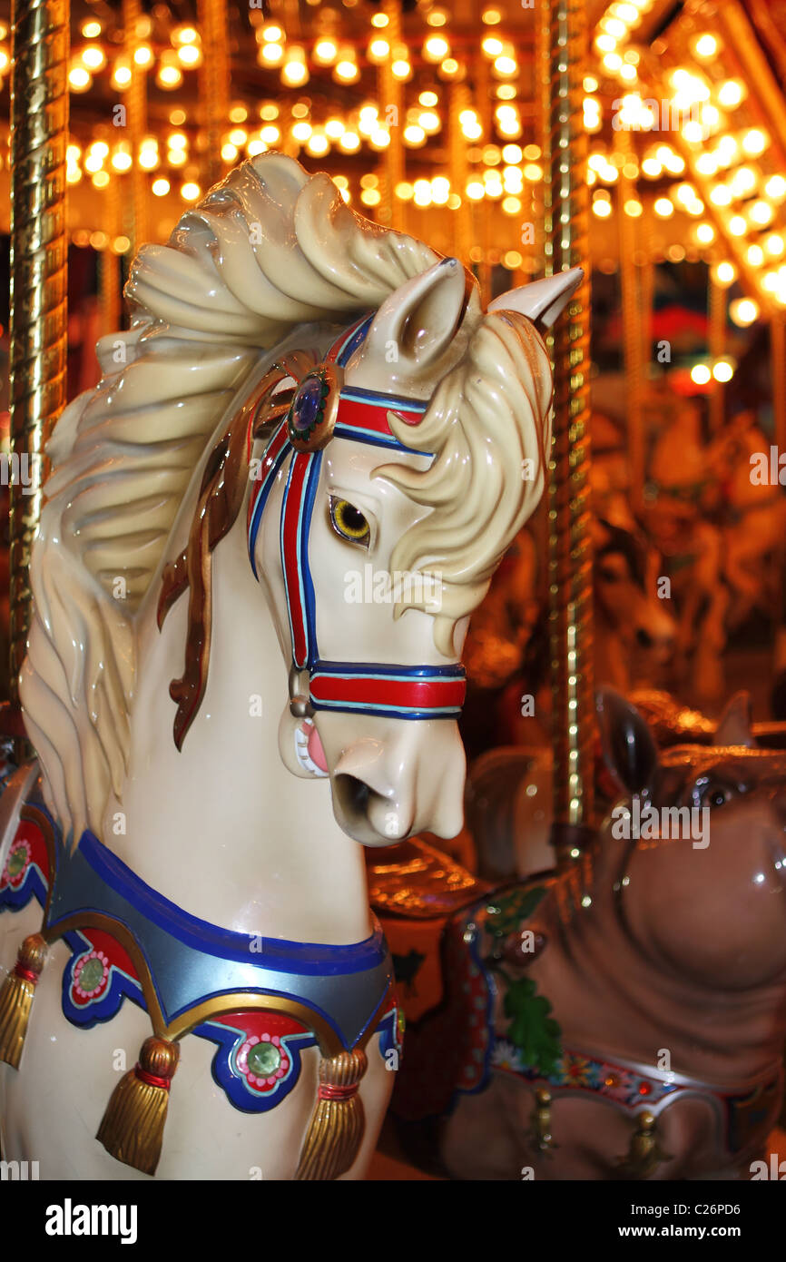 Beautifully decorated carousal horses on a merry-go-round Stock Photo