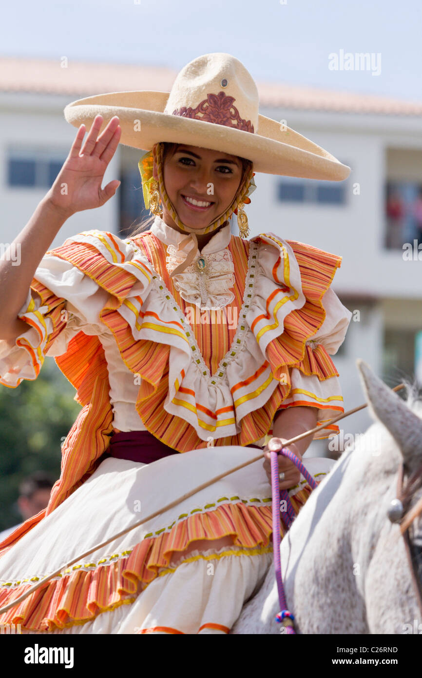 Mexican girl on horseback riding through Puerto Vallarta, Jalisco, Mexico Stock Photo