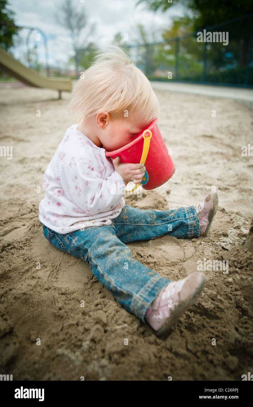 1 Year old girl in Playground Sandbox Playing with Sand Toy Stock Photo Alamy