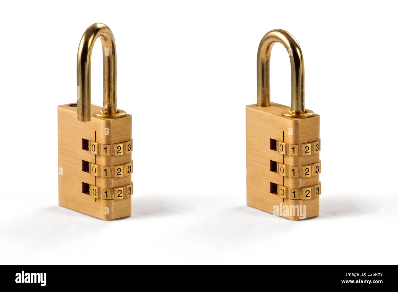 Two combination locks side by side, one locked and other open Stock