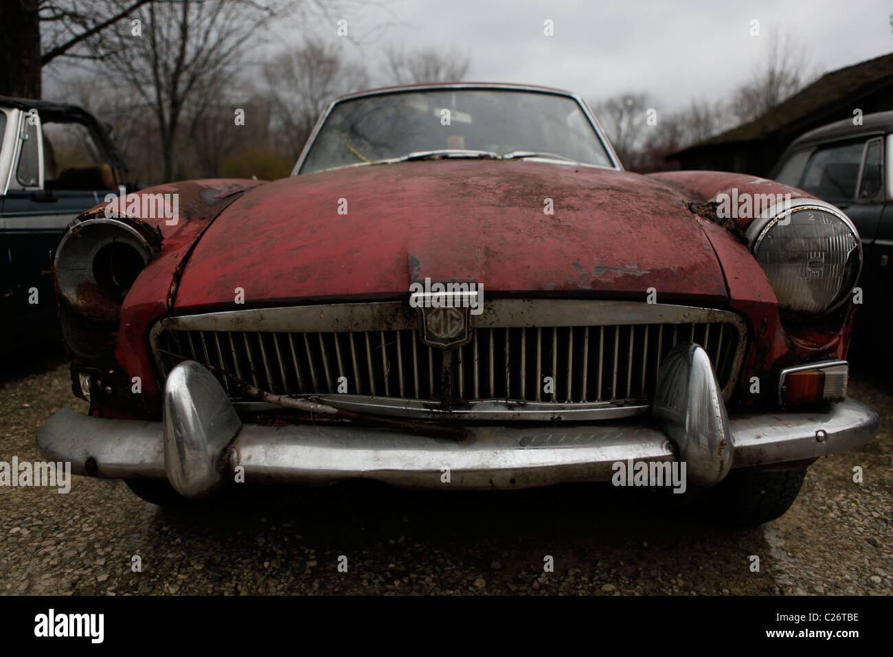 MG British Sportscar sits before auction sale next to a barn in rural Indiana. sports car BGT front grill Stock Photo