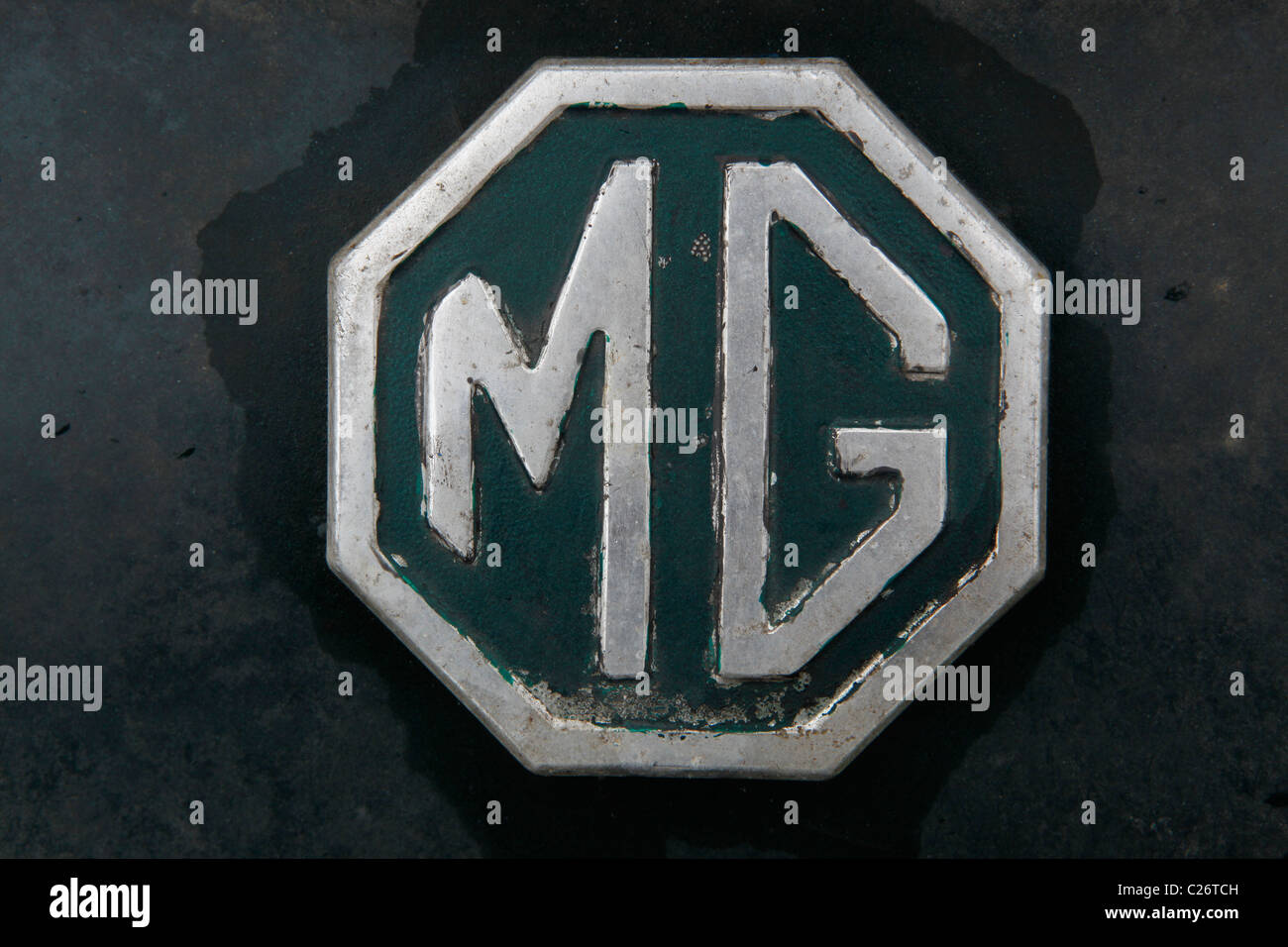 MG British Sportscar sits before auction sale next to a barn in rural Indiana. sports car emblem detail  Stock Photo