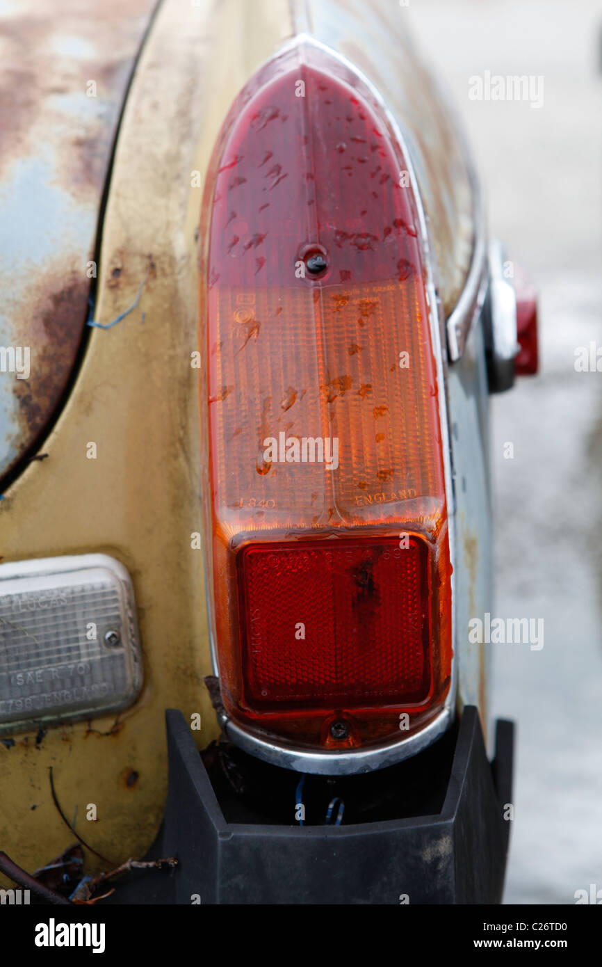MG British Sportscar sits before auction sale next to a barn in rural Indiana. sports car tail light detail  Stock Photo