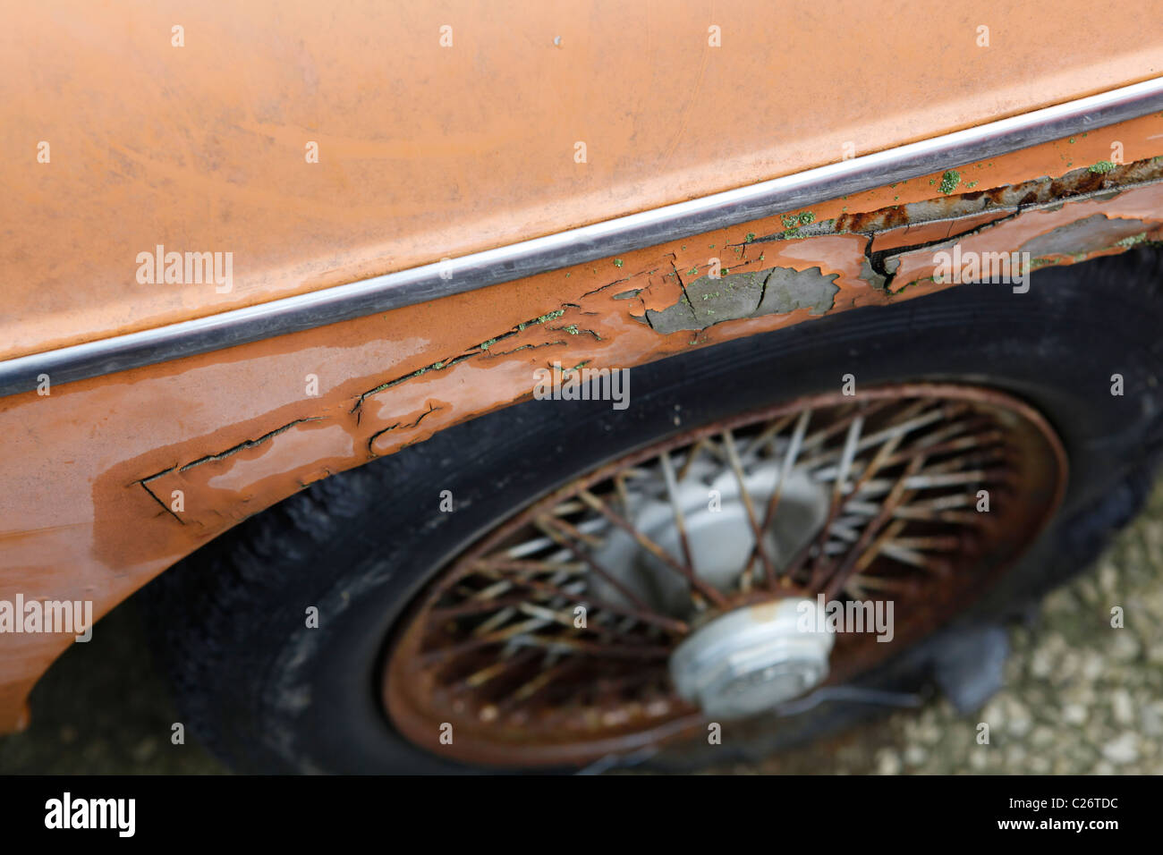 MG British Sportscar sits before auction sale next to a barn in rural Indiana. sports car fender spoked wheel Stock Photo