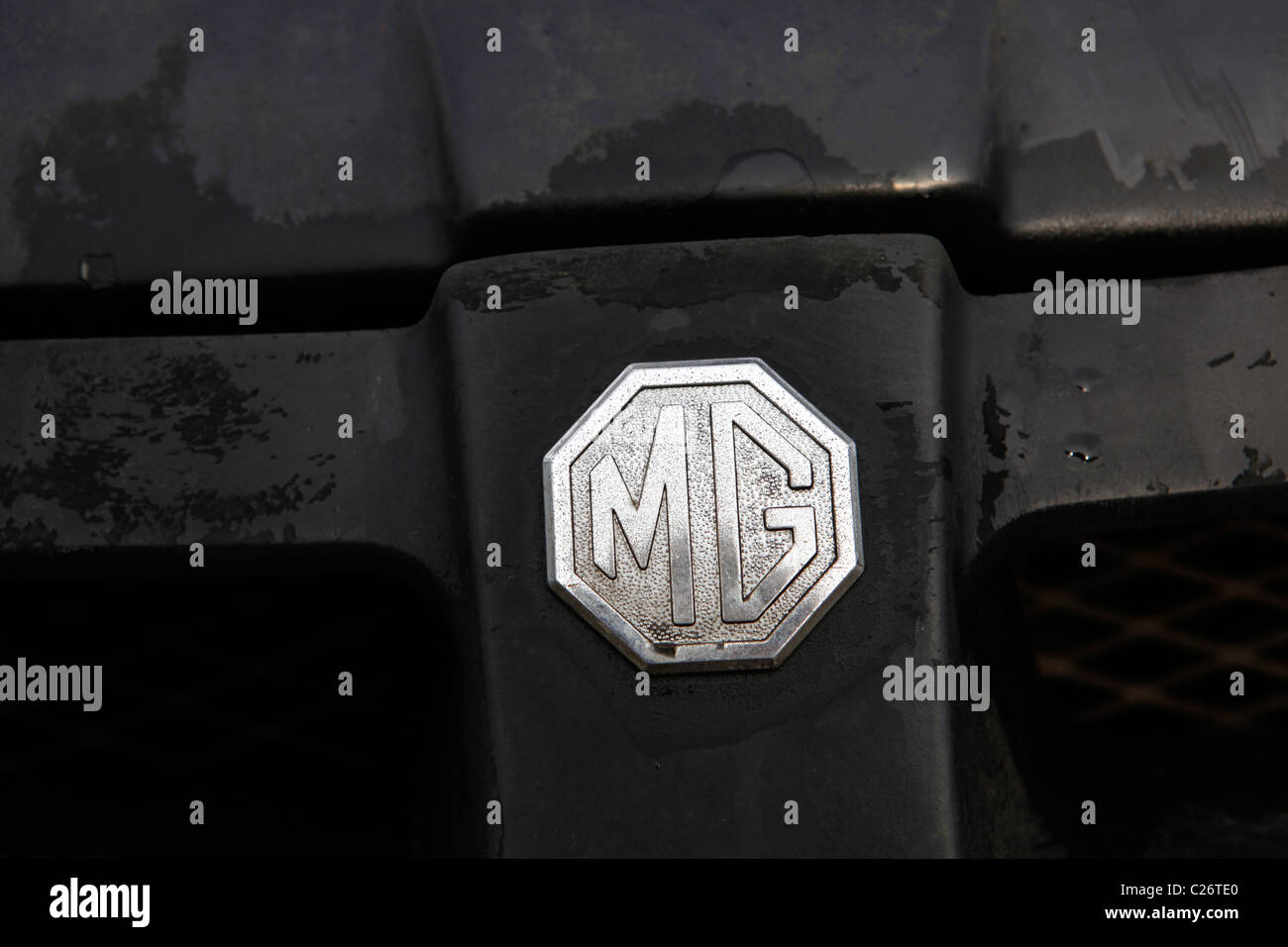 MG British Sportscar sits before auction sale next to a barn in rural Indiana. sports car emblem detail Stock Photo