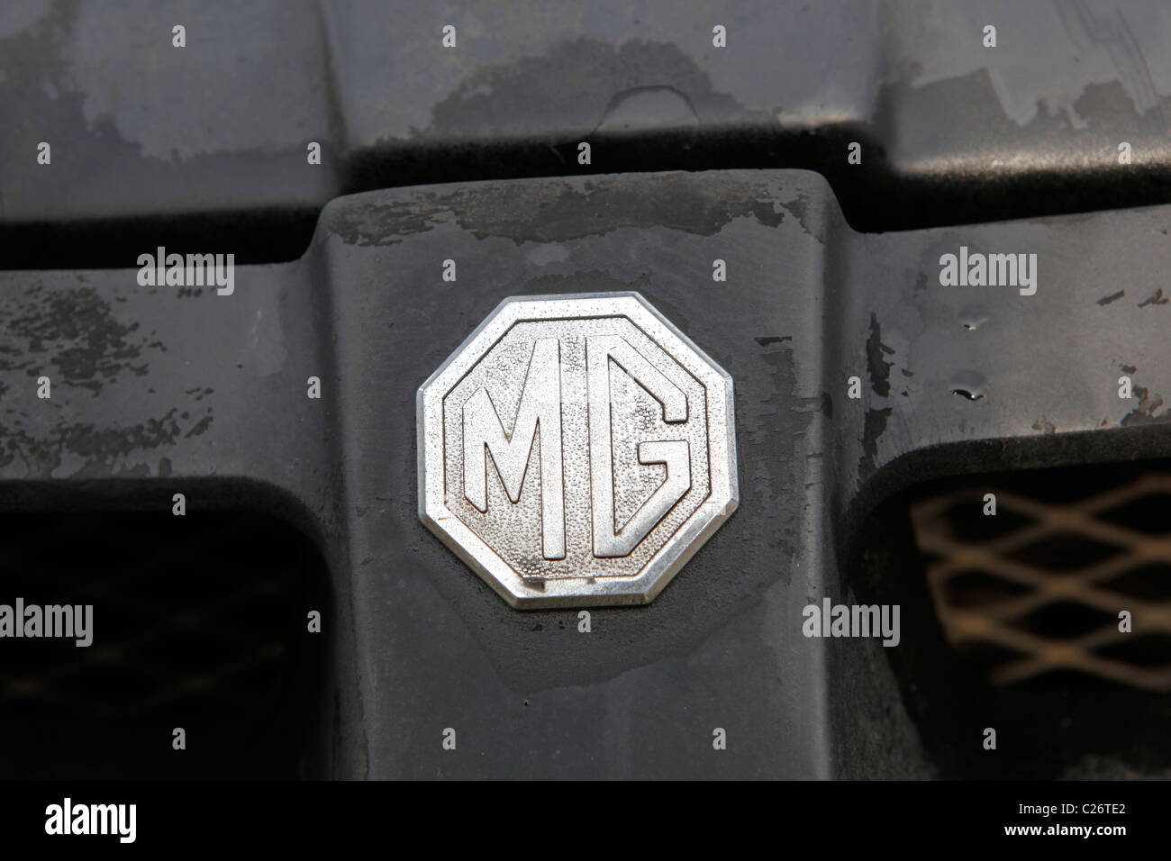 MG British Sportscar sits before auction sale next to a barn in rural Indiana. sports car emblem detail Stock Photo