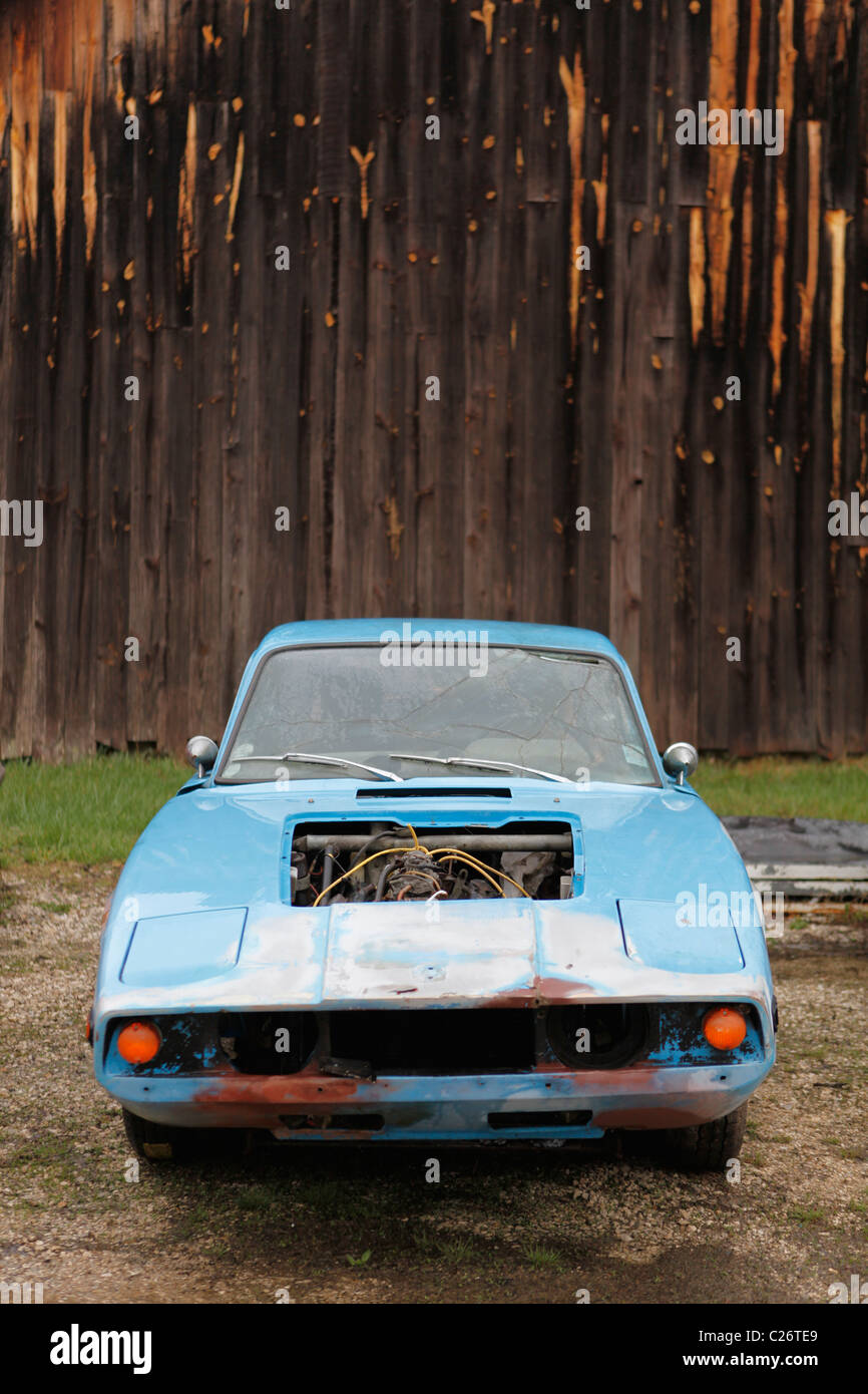 SAAB Sportscar sits before auction sale next to a barn in rural Indiana. sports car Stock Photo