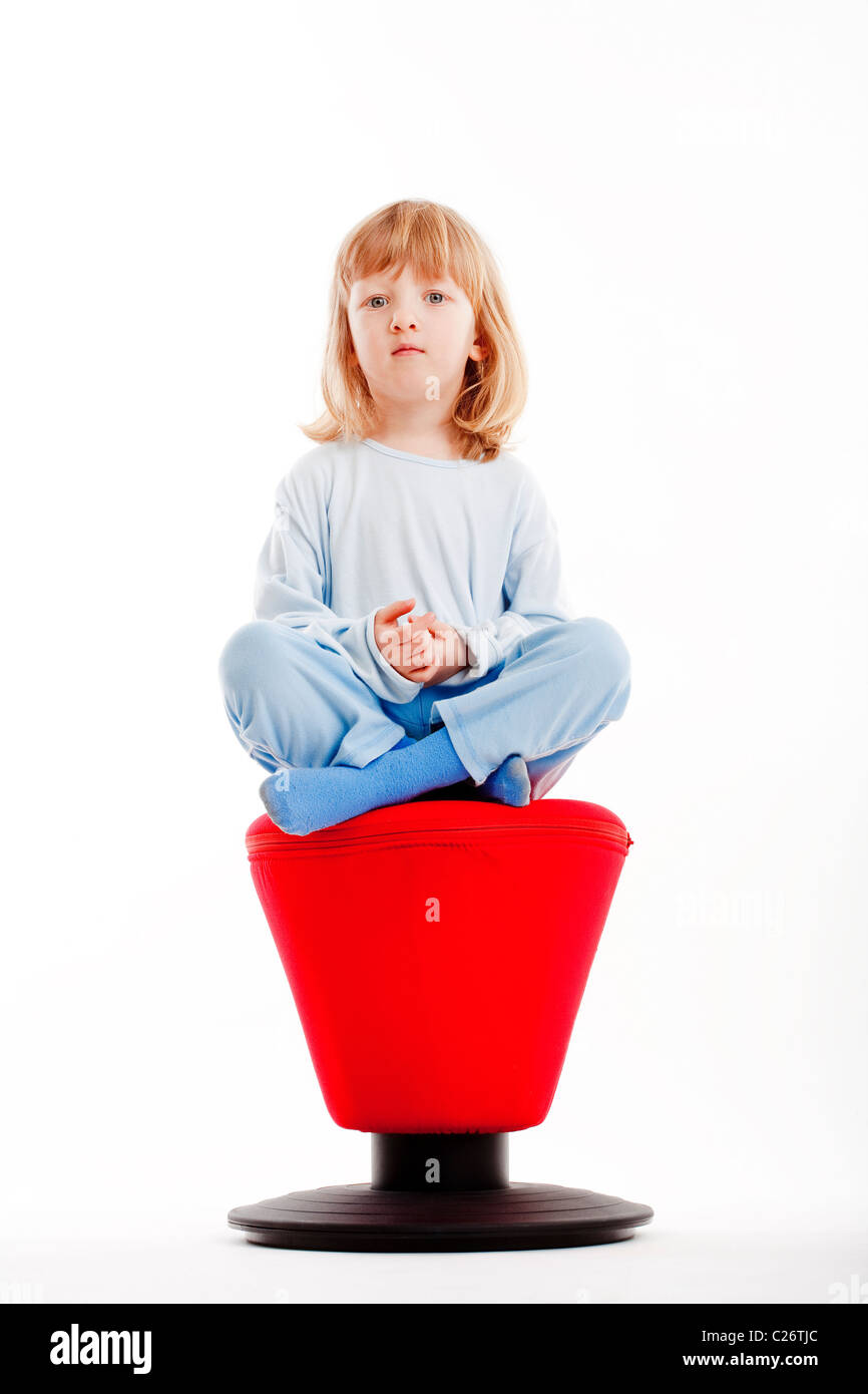 Boy sitting on stool hi-res stock photography and images - Alamy