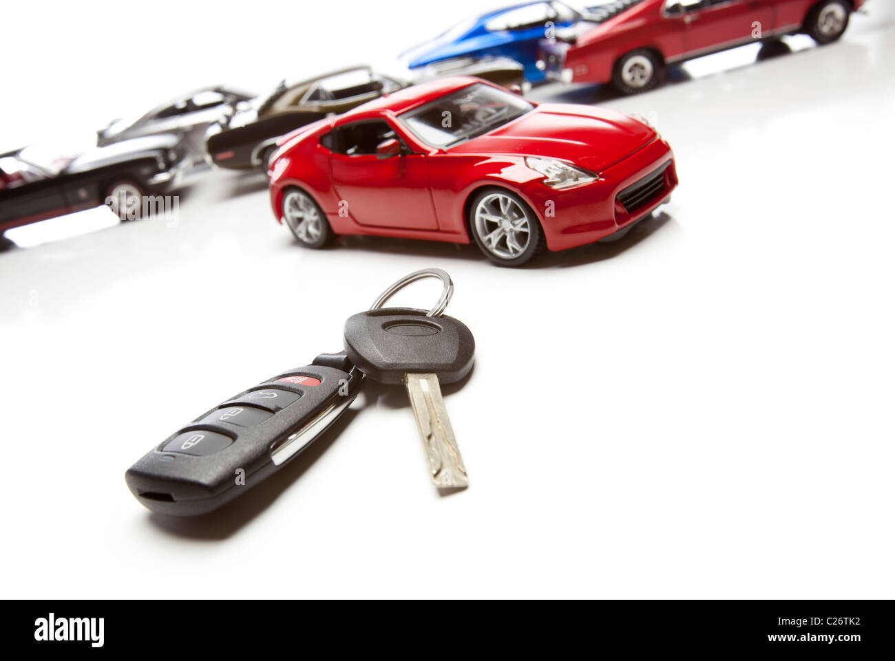 Car Keys and Several Sports Cars on White Background Stock Photo Alamy
