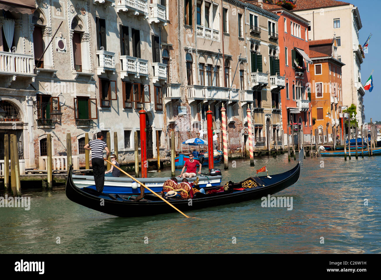 Gondola gliding along the Grand Canal in Venice Italy Stock Photo - Alamy