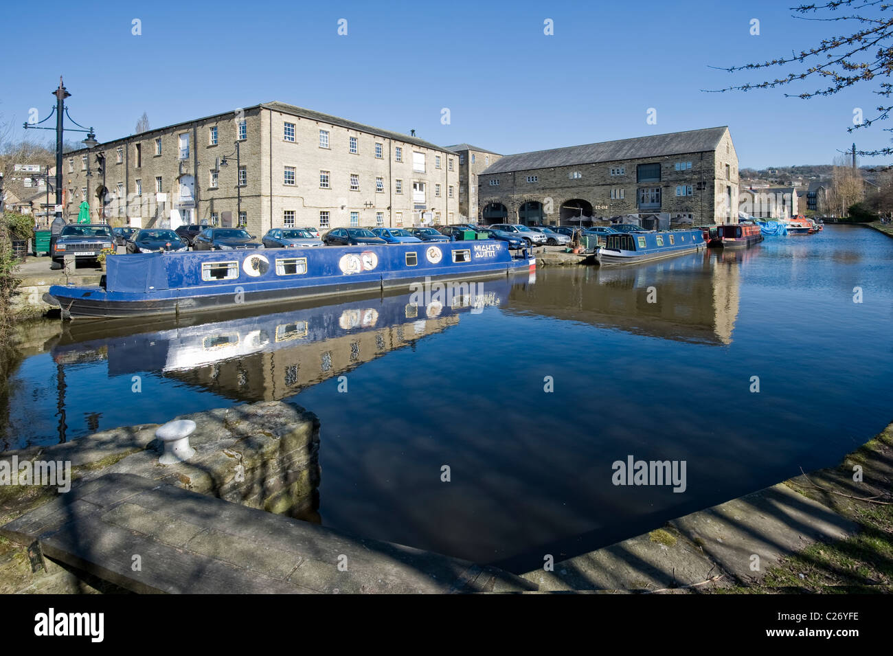 Canal boats in springtime on the rochdale canal at moorings at sowerby bridge basin nr halifax, calderdale. Stock Photo