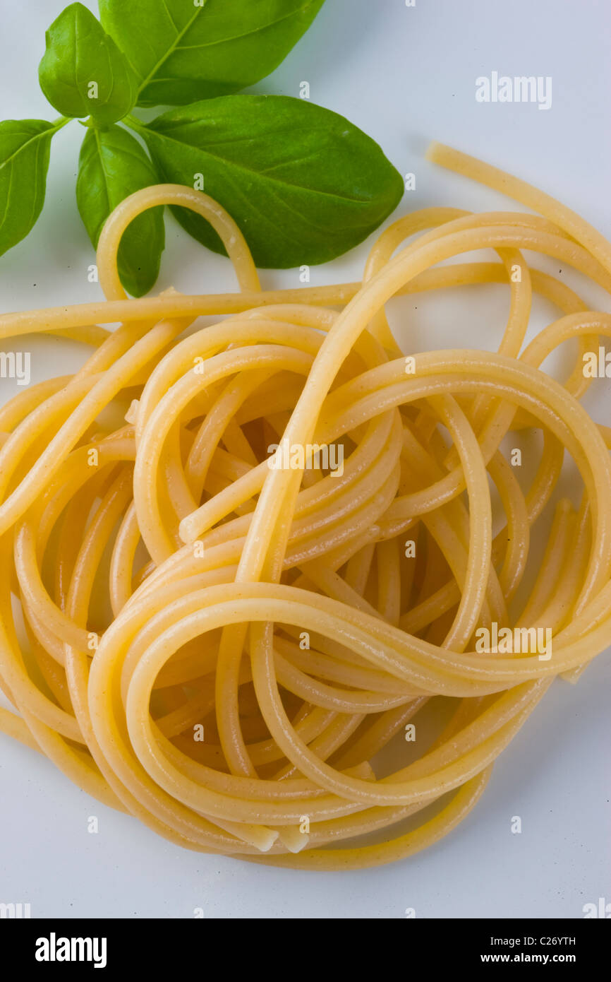 Spaghetti and Basil Leaves Stock Photo Alamy
