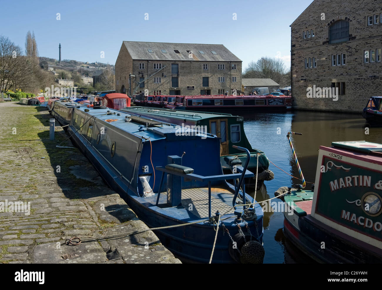 canal boats at moorings on clear spring day Stock Photo
