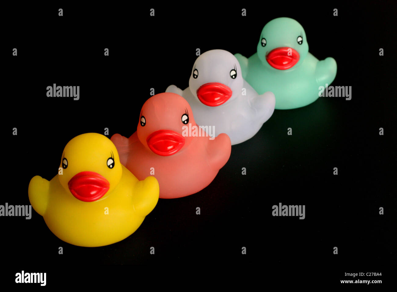 Four rubber ducks in a row Stock Photo