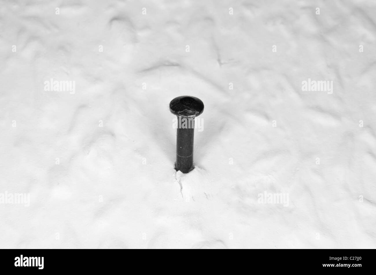 Nail in wall Stock Photo Alamy