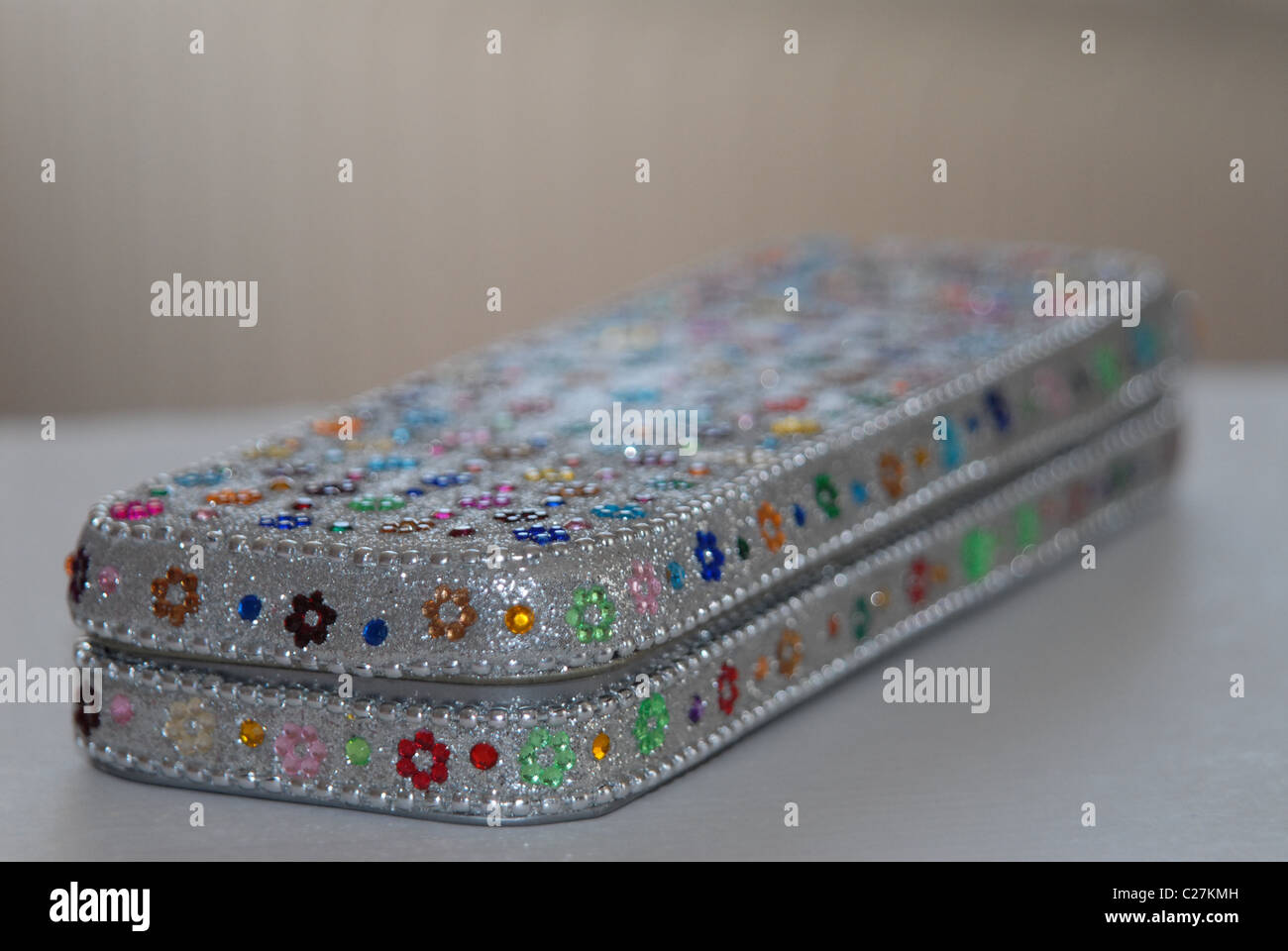 Pencil case decorated with gem stones on a desk Stock Photo - Alamy