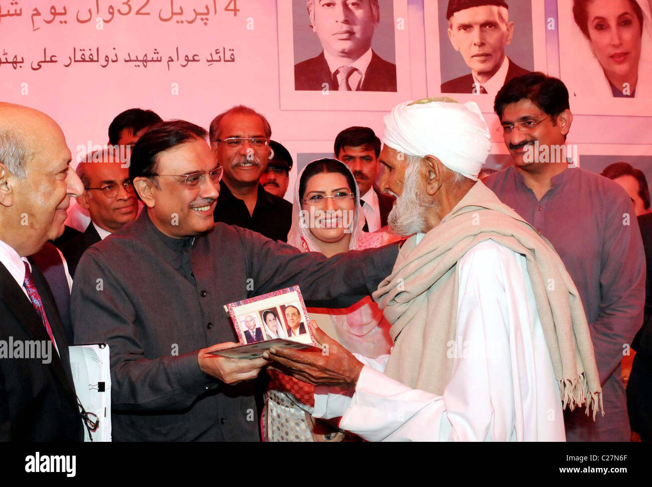 President, Asif Ali Zardari gives away Benazir Zarai Cards (agri card) during ceremony on occasion of the thirty Stock Photo