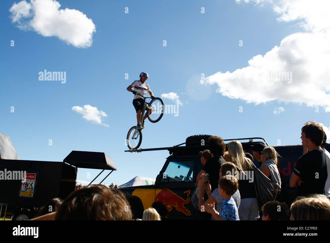 ABSA Cape Epic 2011 Red Bull Champion Rider jumps about 2.5m from trailer to car. Photo: Darryl Putter Stock Photo