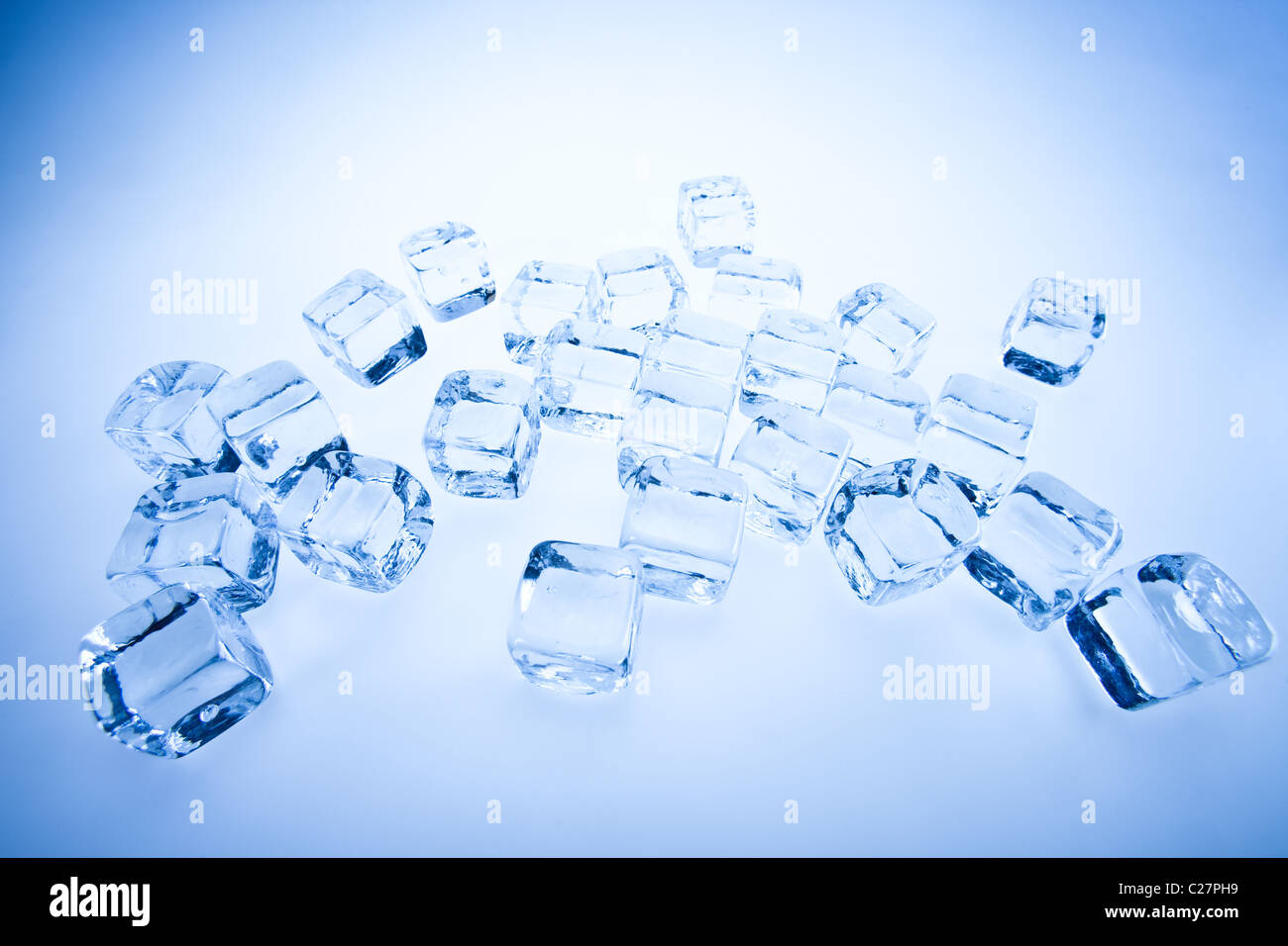 Frozen ice cubes over background Stock Photo - Alamy