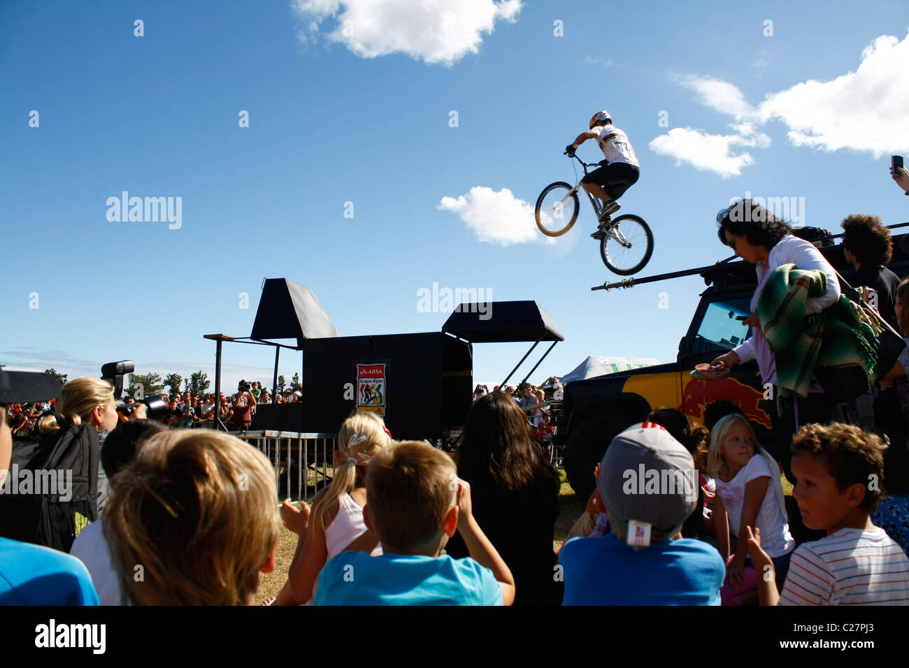 Red Bull Champion Rider Jumps From car approximately 2.5 meters to trailer and makes perfect landing. Photo: Darryl Putter Stock Photo