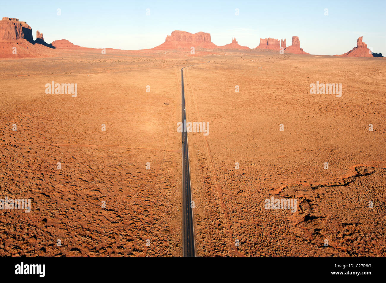 AERIAL VIEW. Road 163 heading north towards Mexican Hat. Navajo Indian land, Monument Valley, Arizona / Utah, USA. Stock Photo