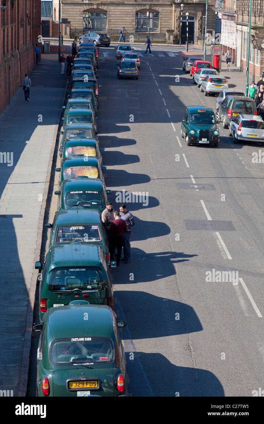taxis waiting in a line outside the railway station Nottingham city centre England UK GB EU Europe Stock Photo