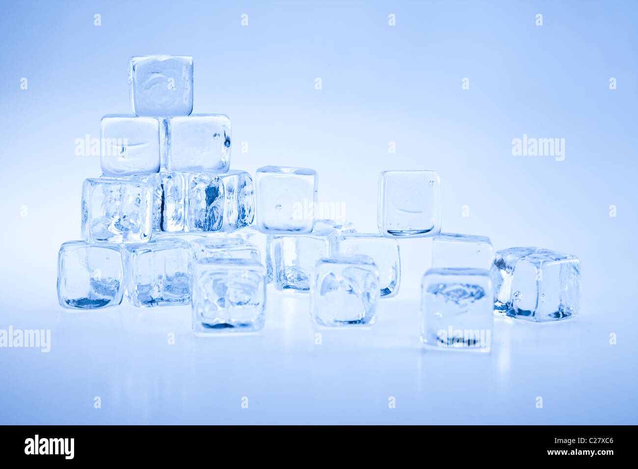 Frozen ice cubes over background Stock Photo - Alamy