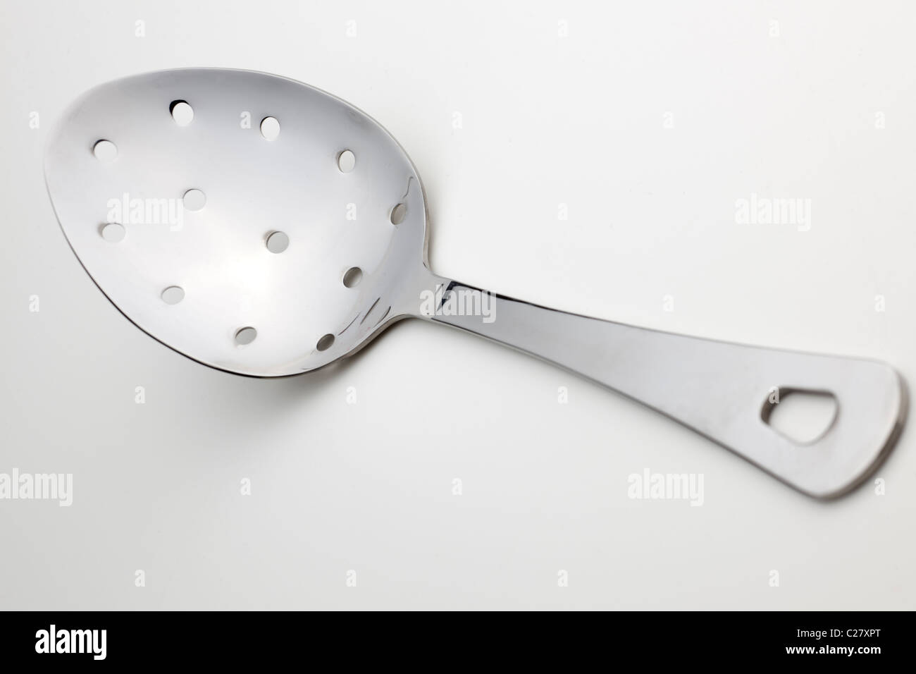 Seamless stainless steel cutlery draining spoon Stock Photo Alamy