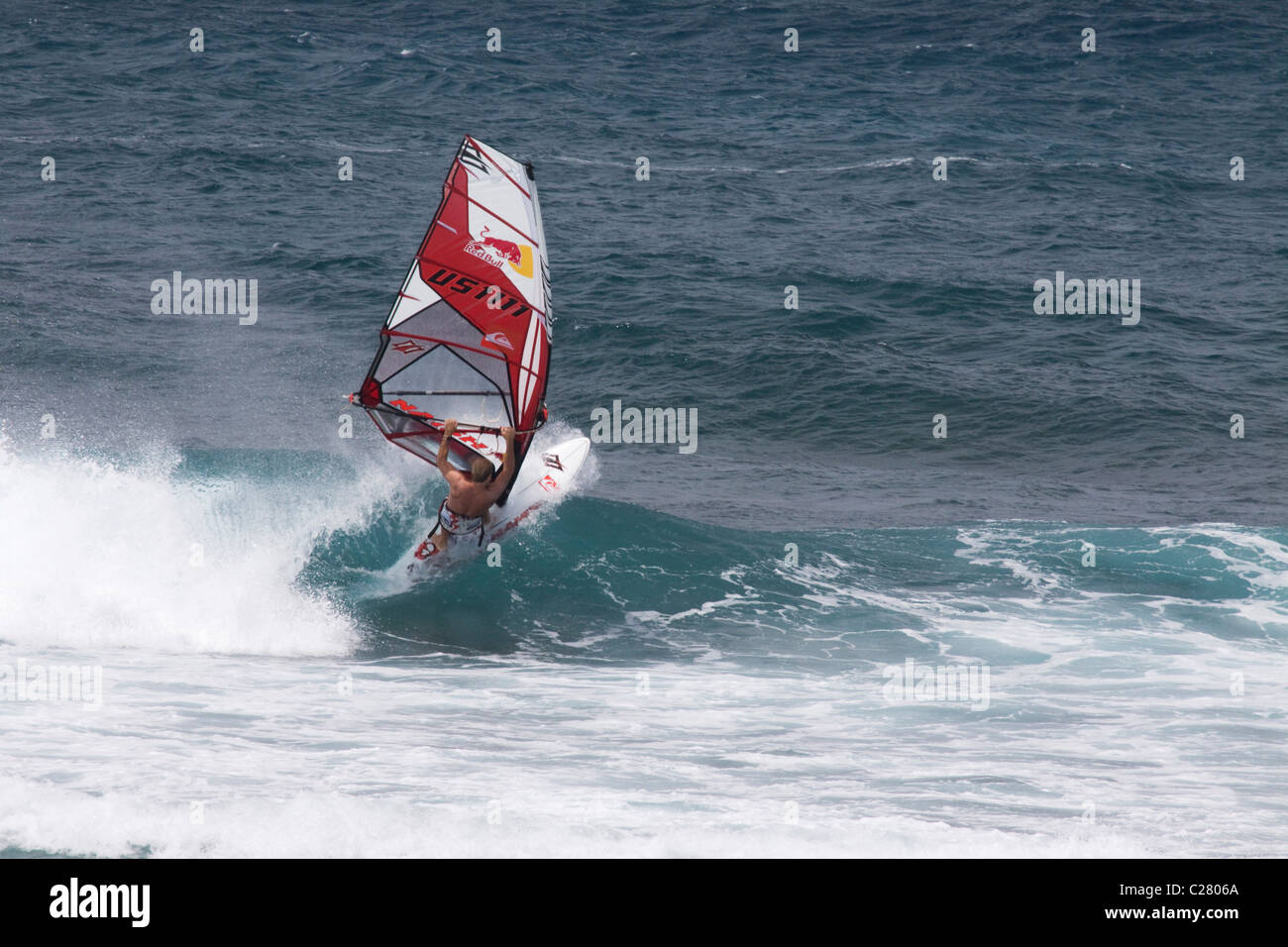 Plowing through. Windsurfing on Mauis famous Hookipa Beach, located on