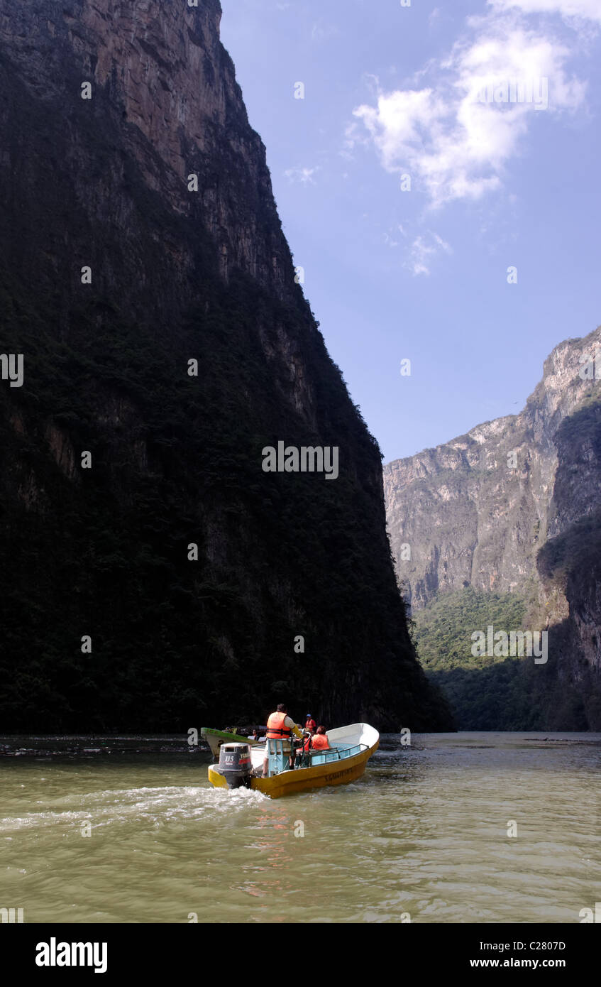 Boat with tourists crossing the Sumidero Canyon Stock Photo