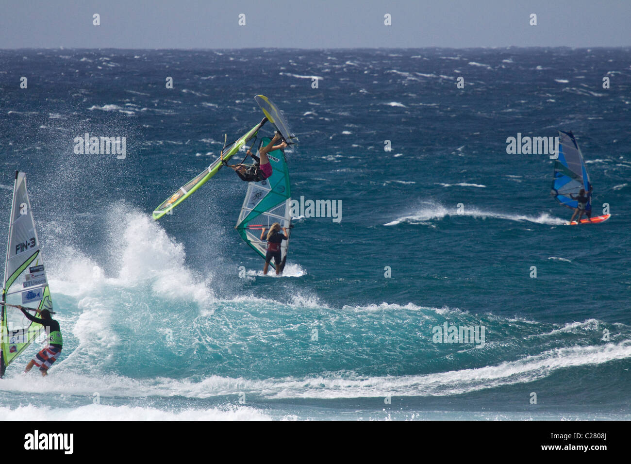 Serious air time. Extreme Windsurfing on Mauis famous Hookipa Beach