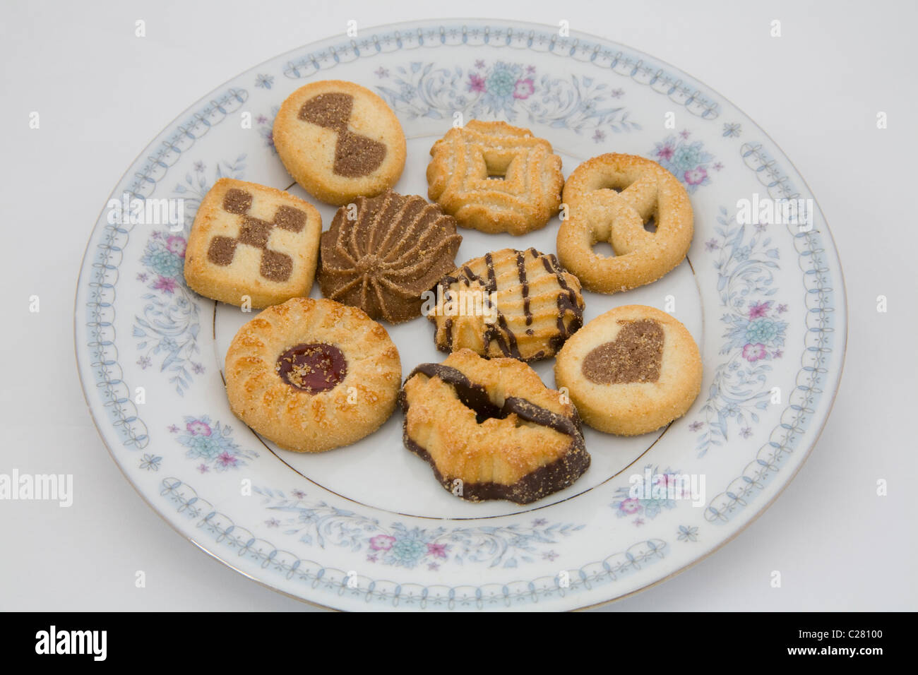 Selection of sweet biscuit cookies on a decorated china plate Stock Photo Alamy