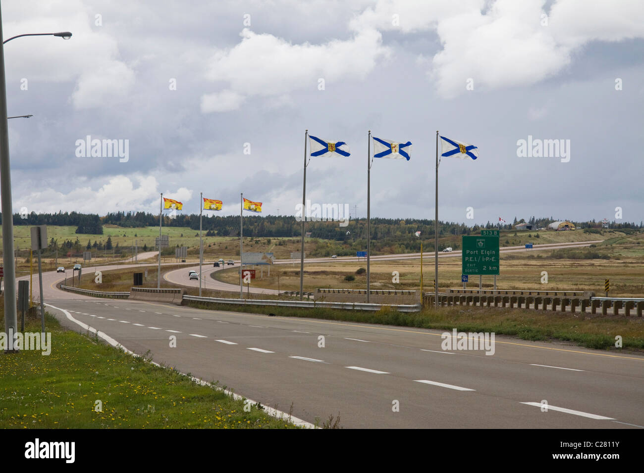 Flags of New Brunswick and Nova Scotia displayed at provincial border