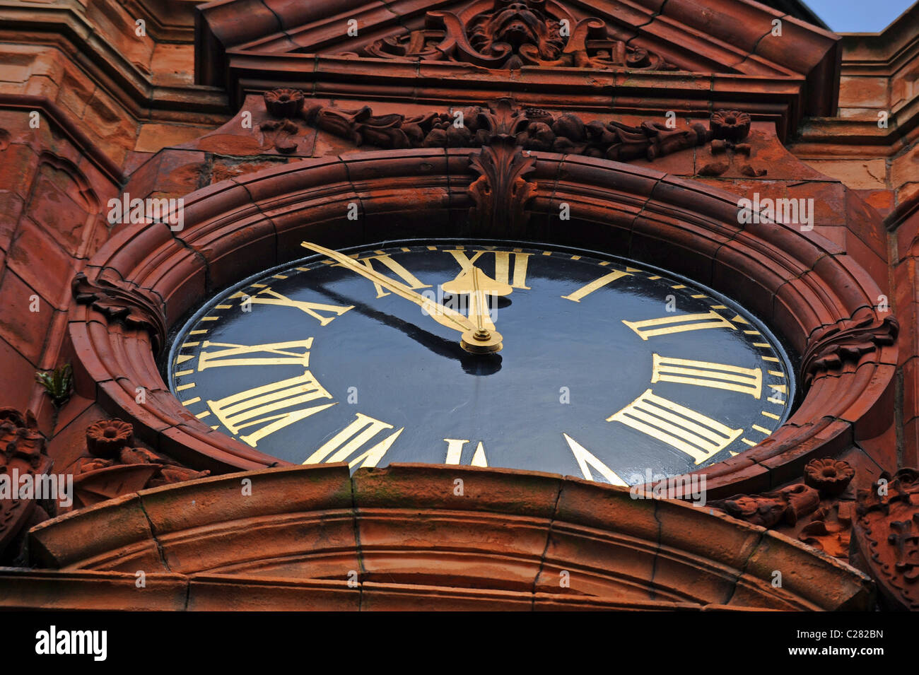 Large clock face showing time at Preston Park clocktower in Brighton UK