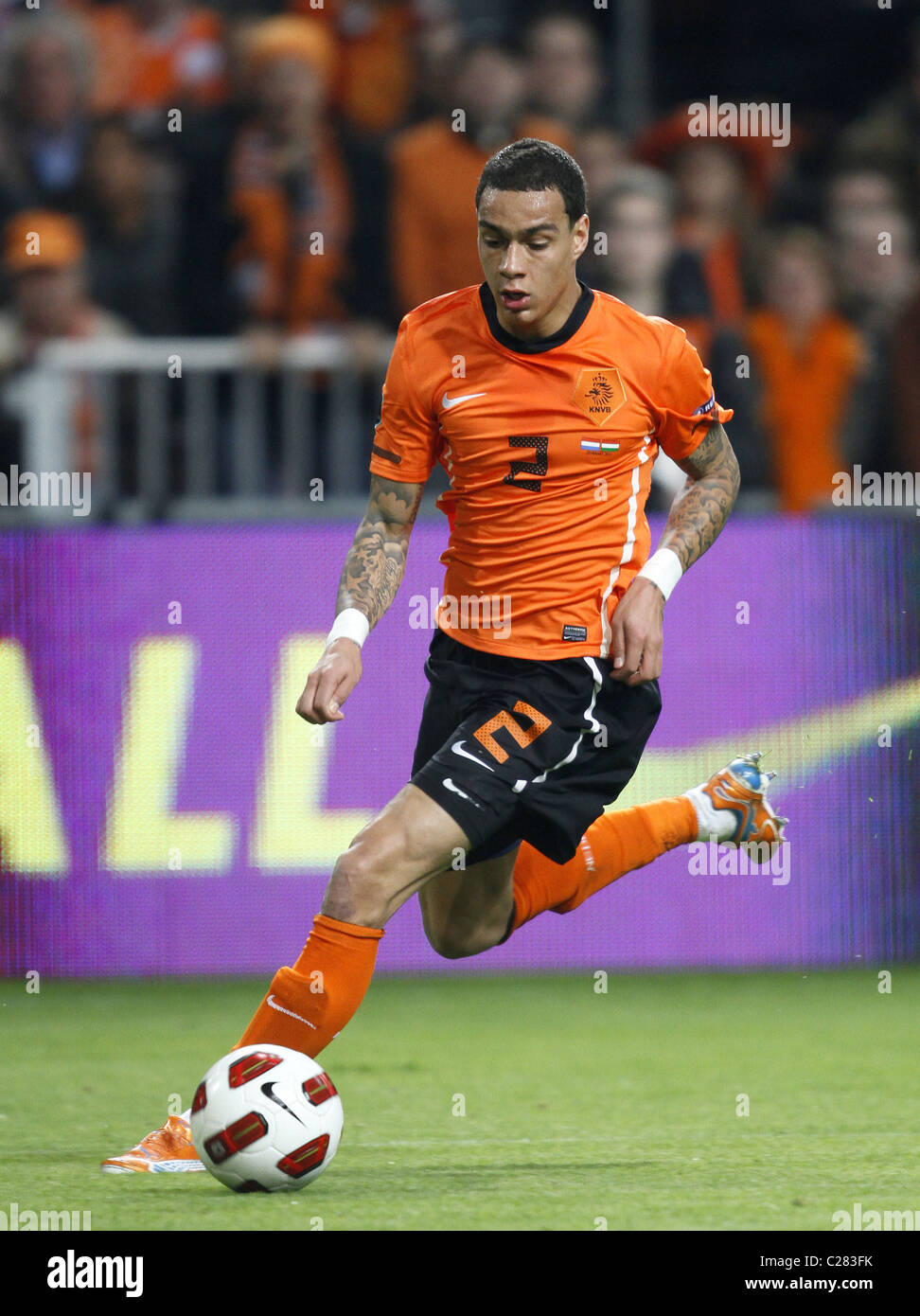 Gregory van der Wiel of the Netherlands eyes the ball during a