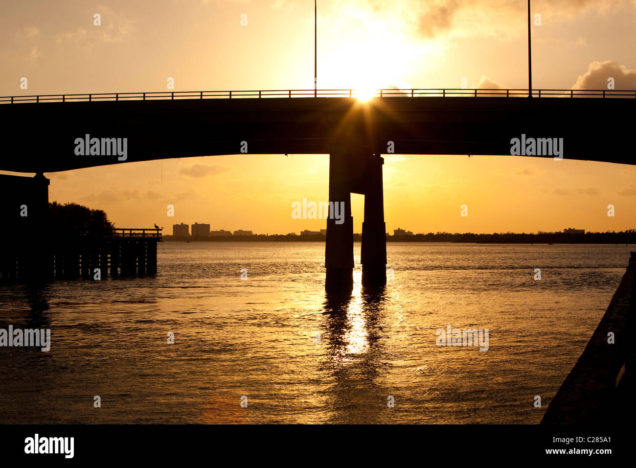 Silhouette of the Collins Avenue flyover backlit at sunset, Haulover Park Bayside, North Miami, Florida, USA. Stock Photo