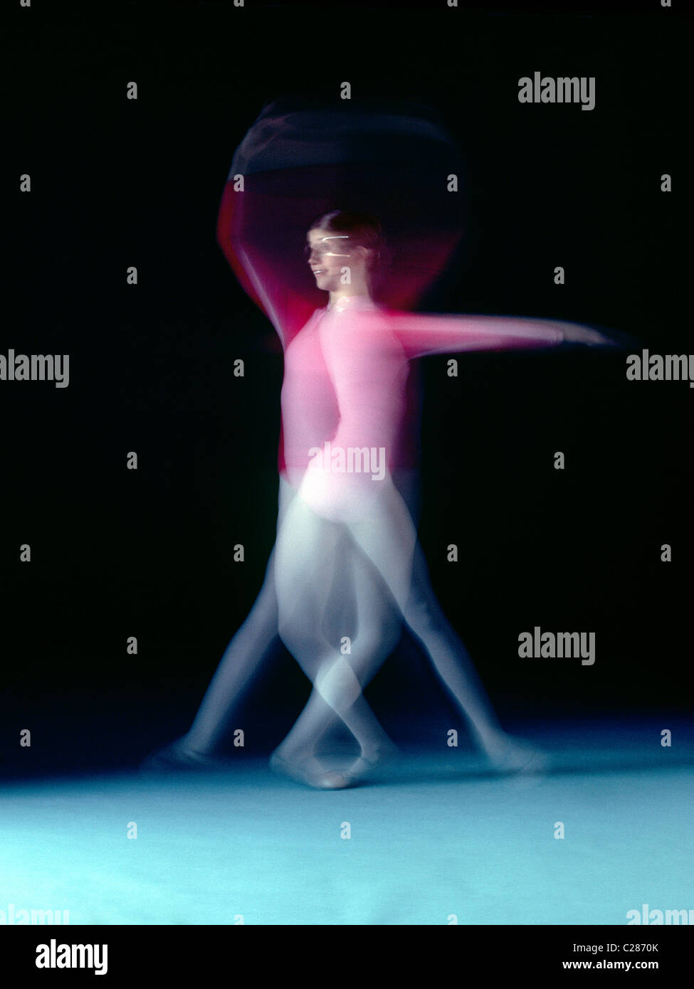 Motion blur of spinning ballet and modern dance student Stock Photo