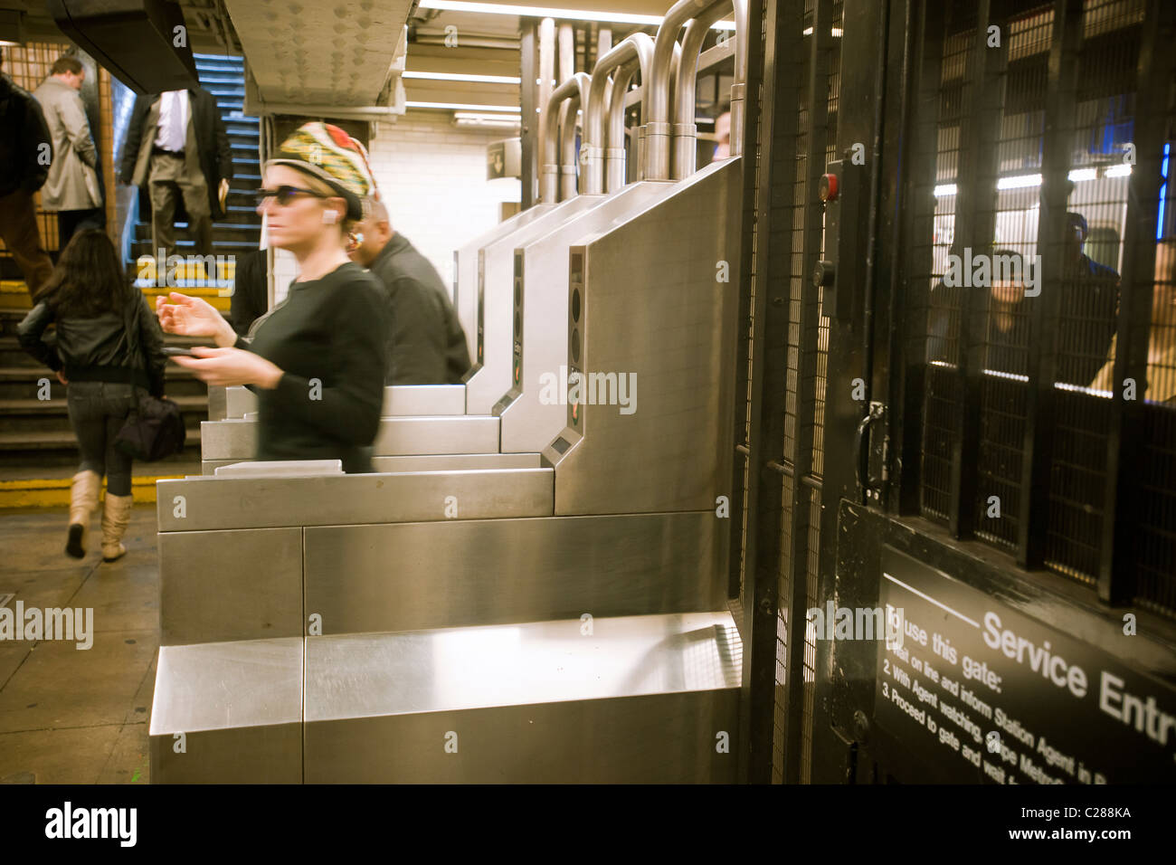 Straphangers exit the subway at the 23rd Street station in New York on Tuesday, April 5, 2011