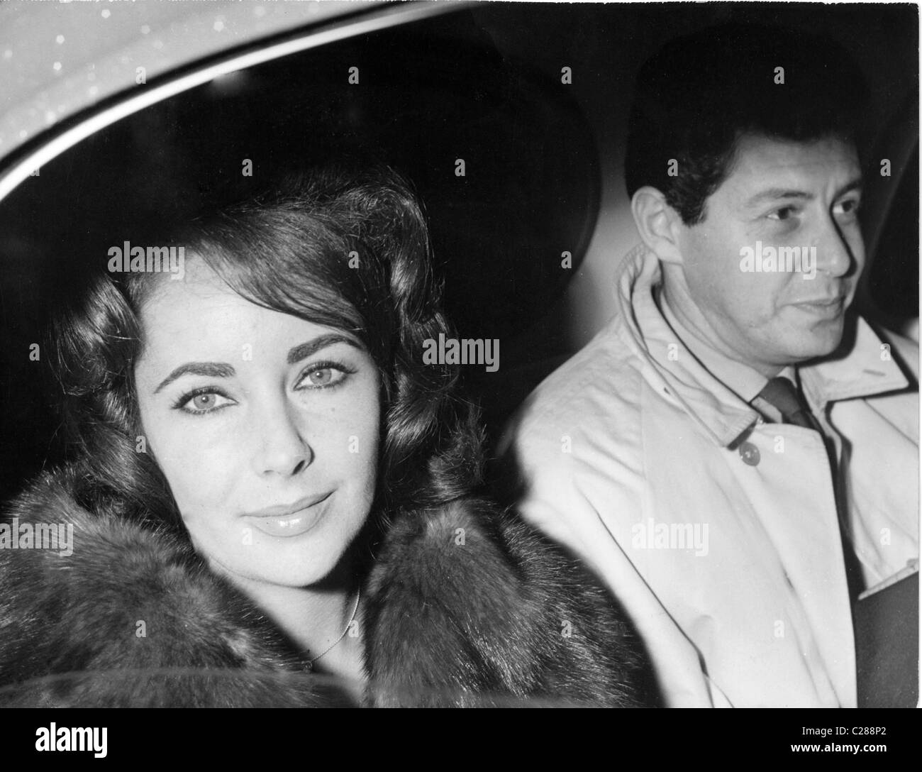 Actress Elizabeth Taylor in car with Eddie Fisher Stock Photo