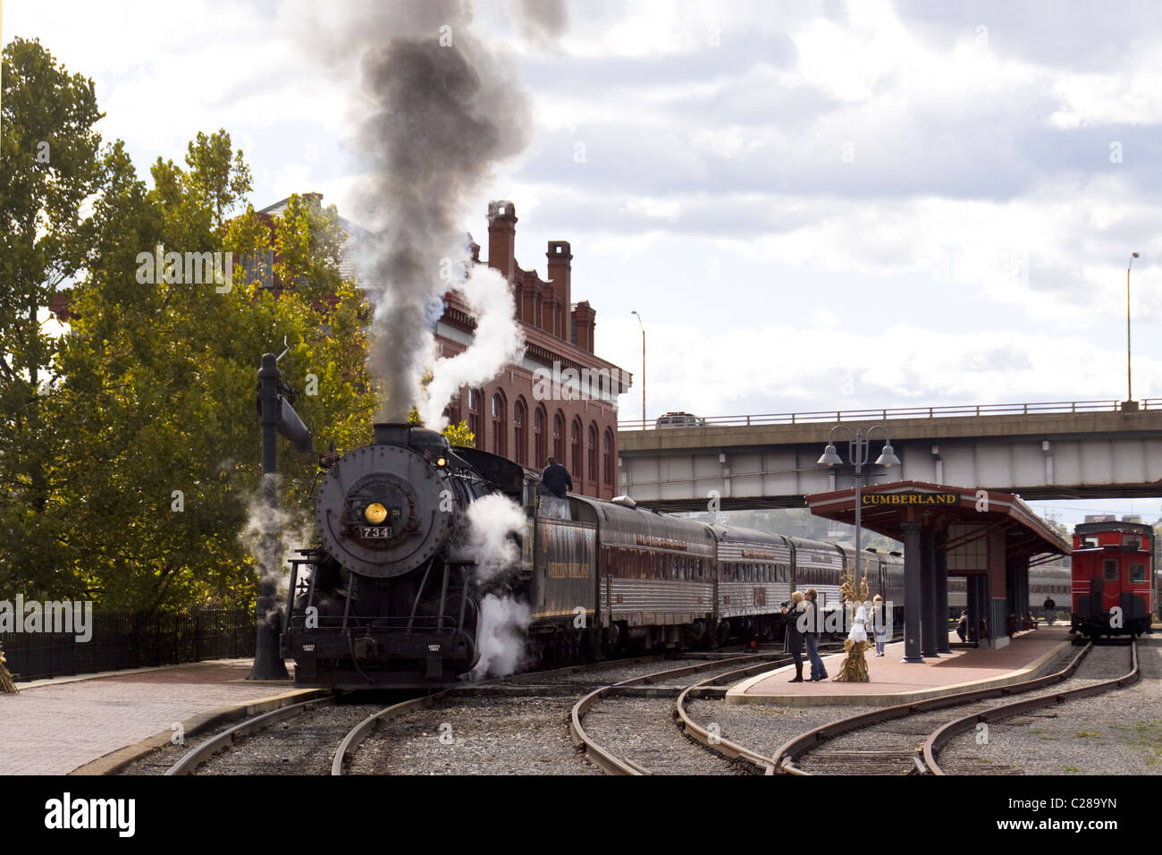 'Mountain Thunder' steam powered locomotive and passenger cars at at Western Maryland Scenic Railroad depot in Cumberland MD. Stock Photo