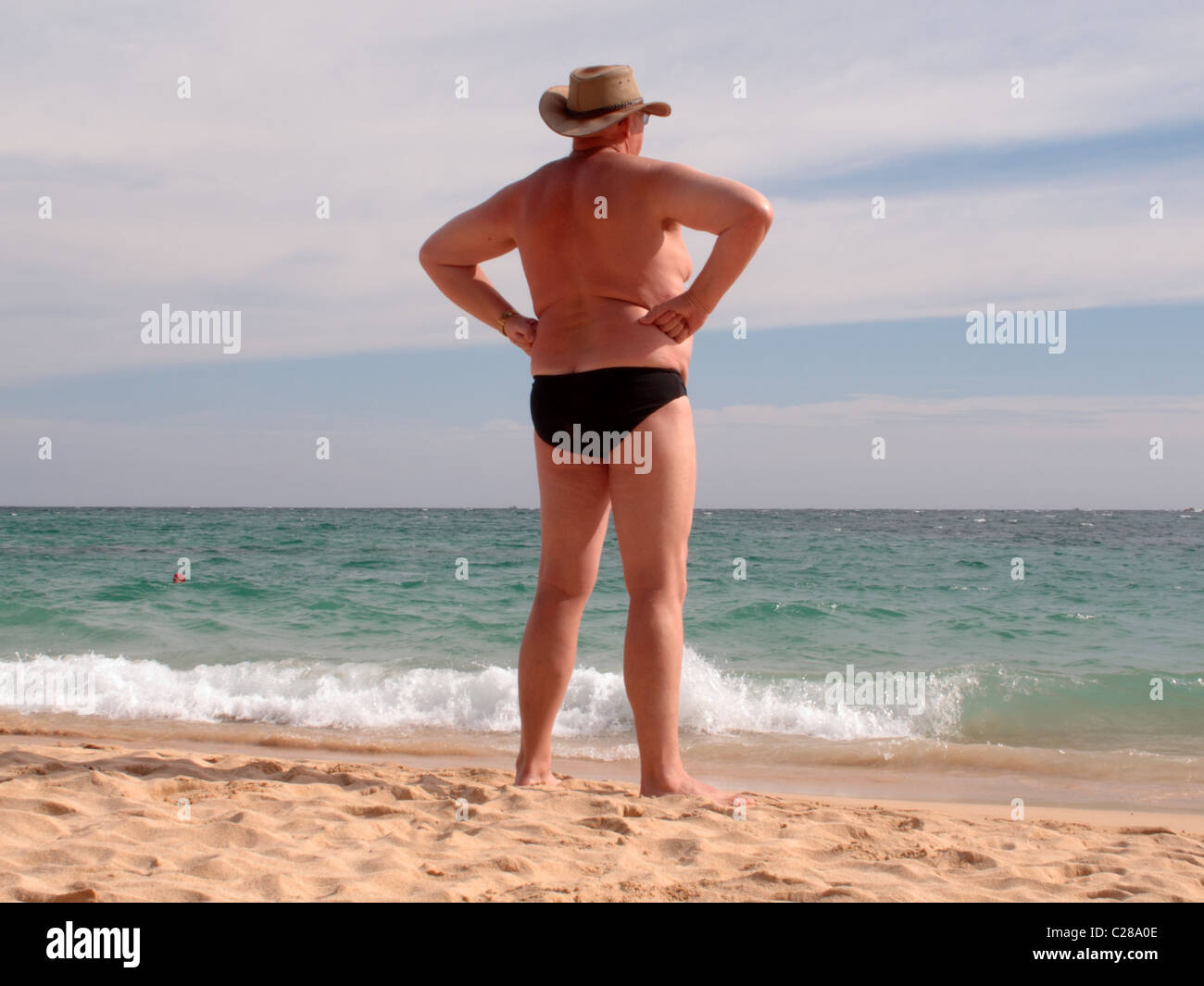 old man looks out to sea on a beach holiday in Sri Lanka. Picture taken on  Unawatuna beach Stock Photo - Alamy