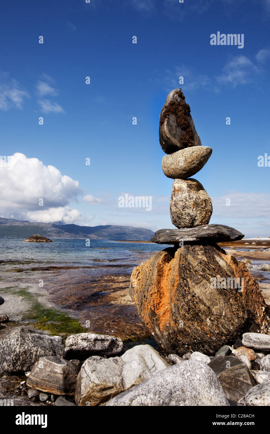 Suporting Statue Rocks A rock stacking sculpture statue on a Norwegian landscape Stock Photo ...