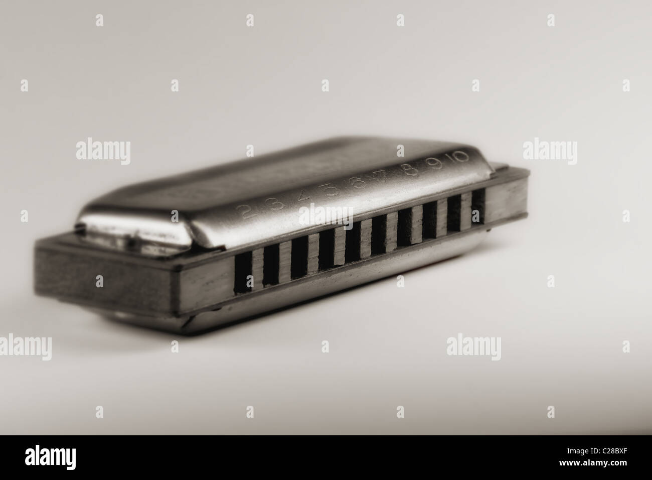 Blues harmonica , shallow DOF retro style toned photo Stock Photo