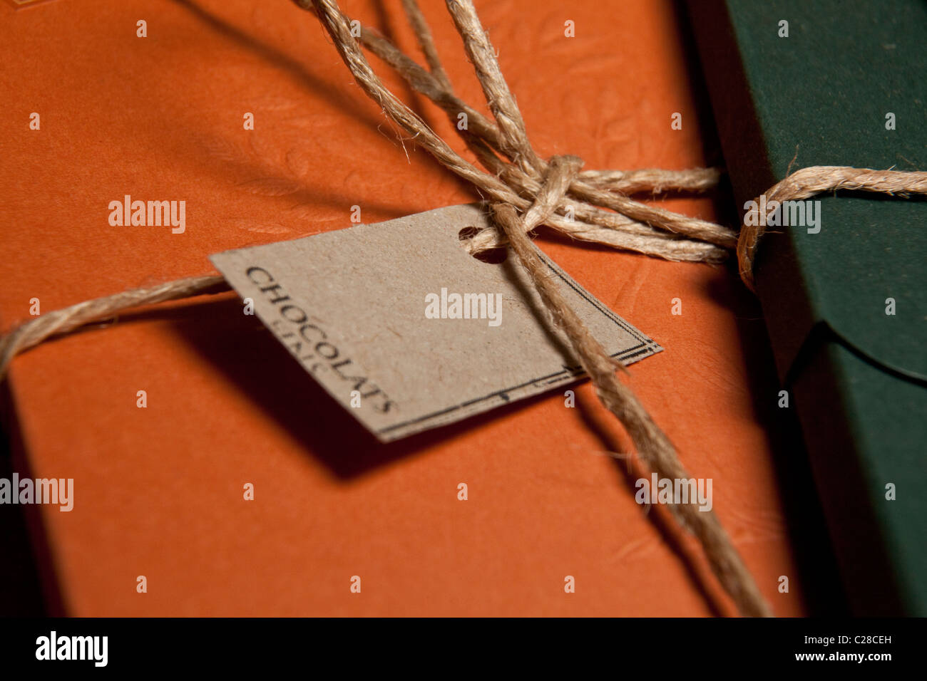 Chocolate Label and gift warpped with empty label and cocoa on on brown box. Stock Photo